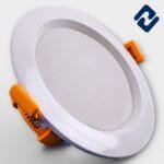 AURONA RAZER LED Concealed Light – energy-efficient, round recessed panel with white finish, orange housing, and secure spring clips for easy installation.