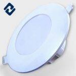 AURONA MINI JUNCTION Deep Light – energy-efficient, round recessed panel with a white finish, orange housing, and secure spring clips for easy installation.